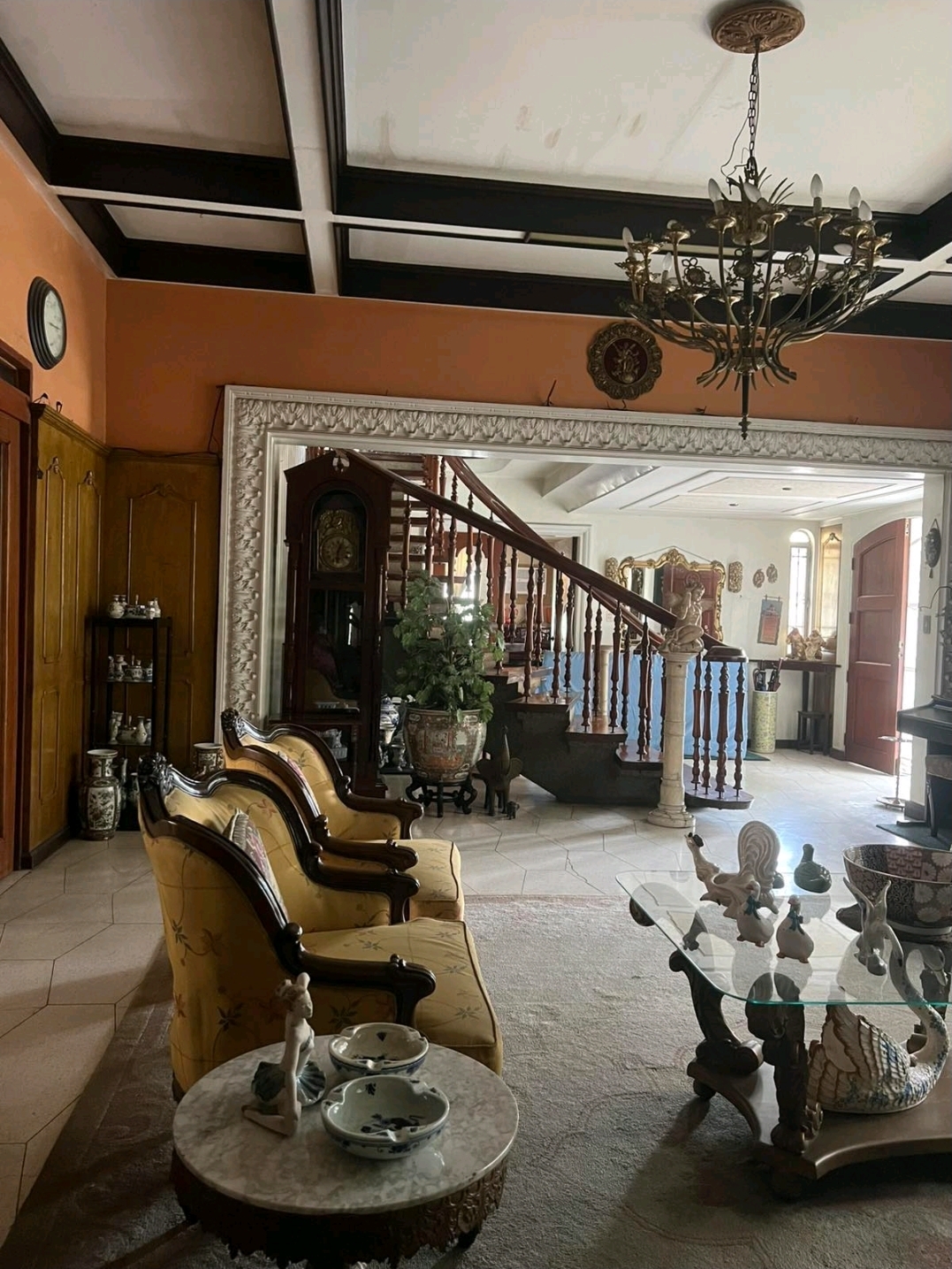Living and foyer area opening to the grand staircase