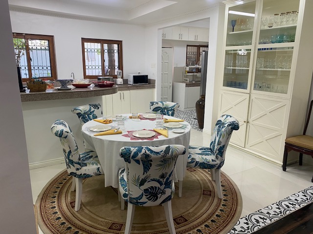 Formal dining area with adjoining modern kitchen