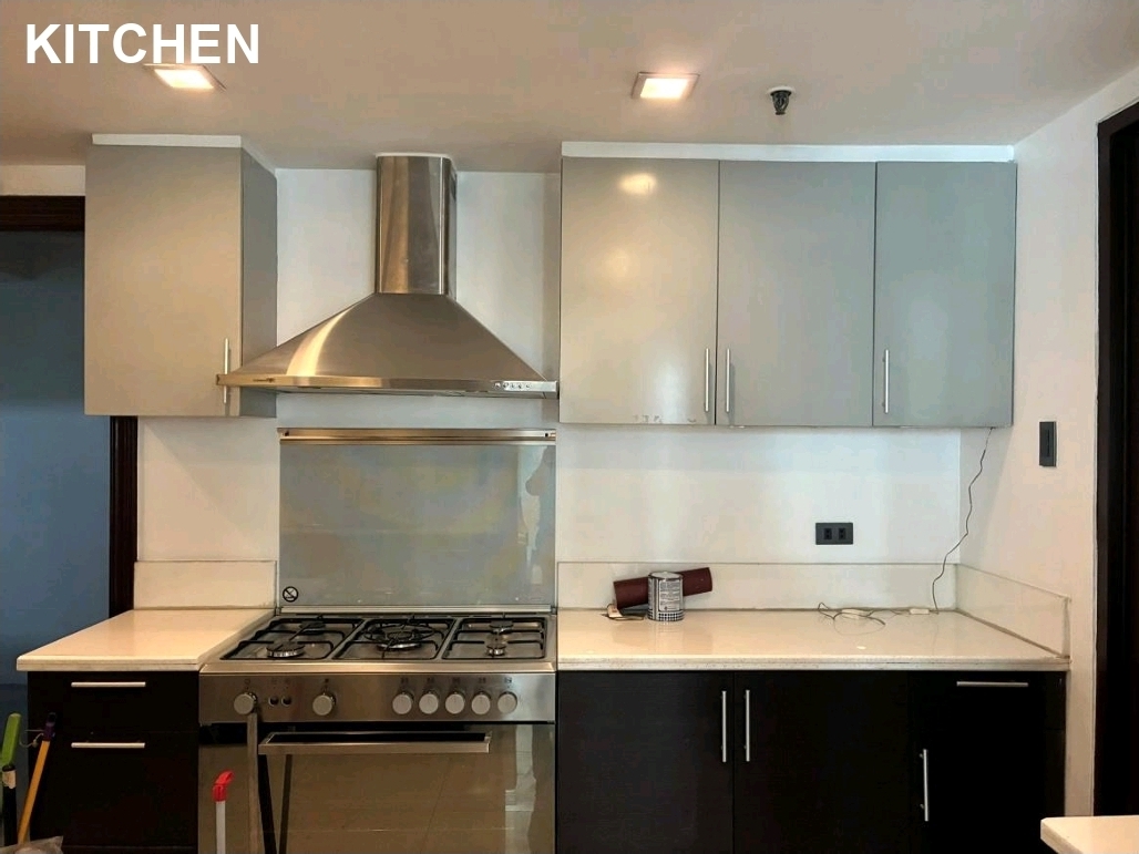 Kitchen with stainless range, hood, and modern cabinetry