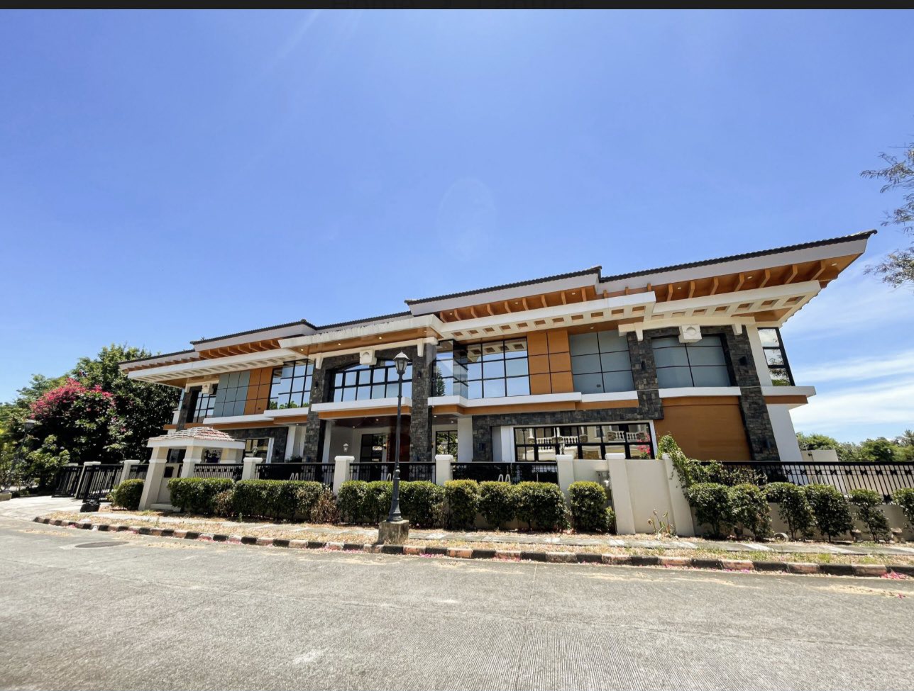 Wide street view of the Brentville villa's full frontage and gated perimeter