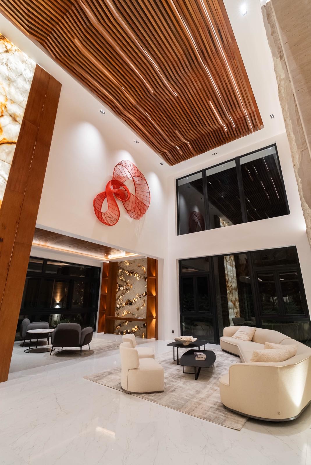 Double-height formal living room with tortoise-shell narra ceiling