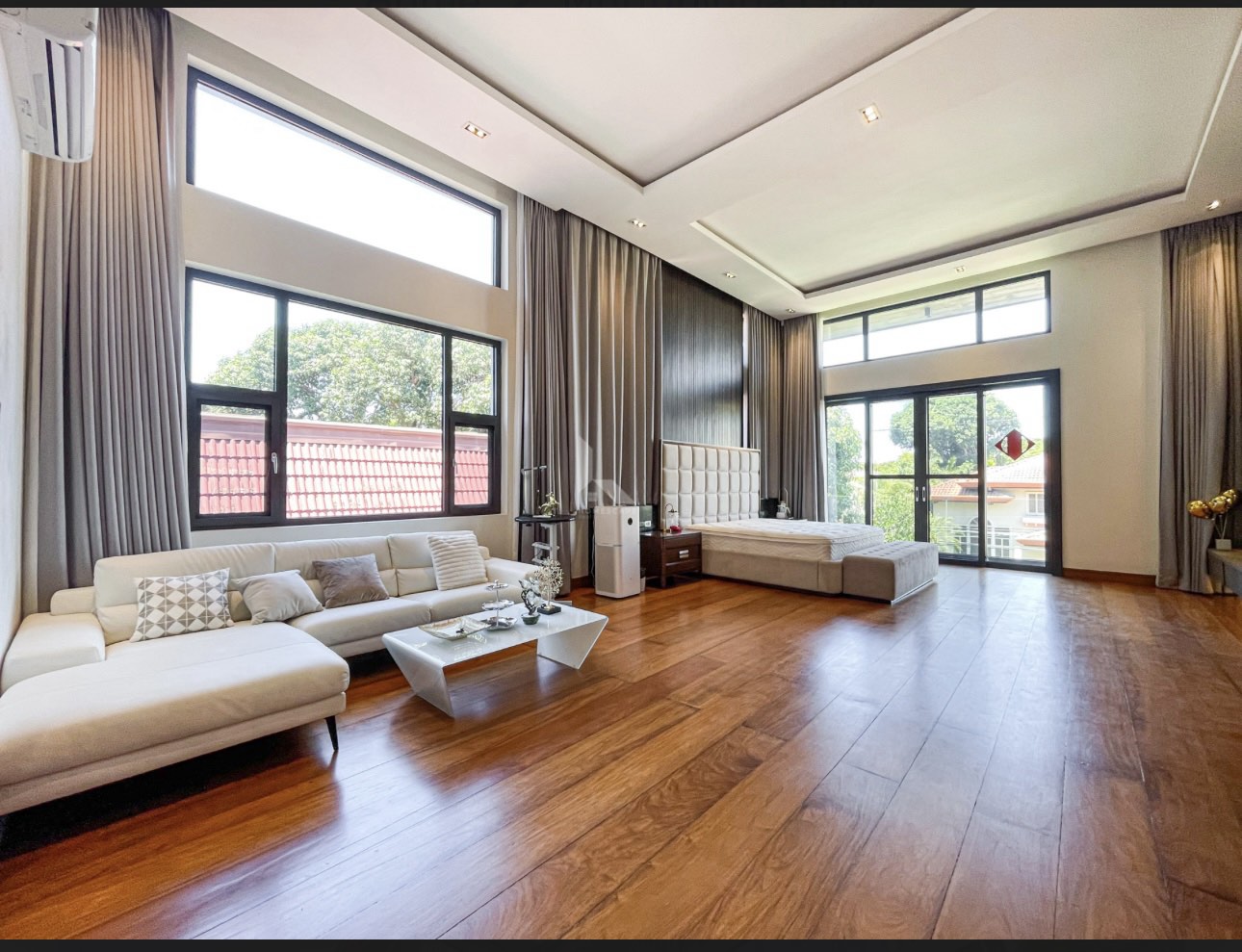 Master suite with hardwood floors, lounge and balcony access