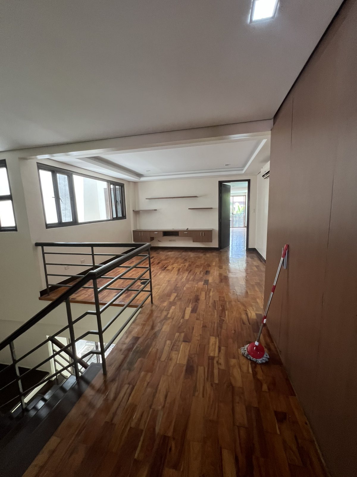 Upper landing and family area with built-in shelving