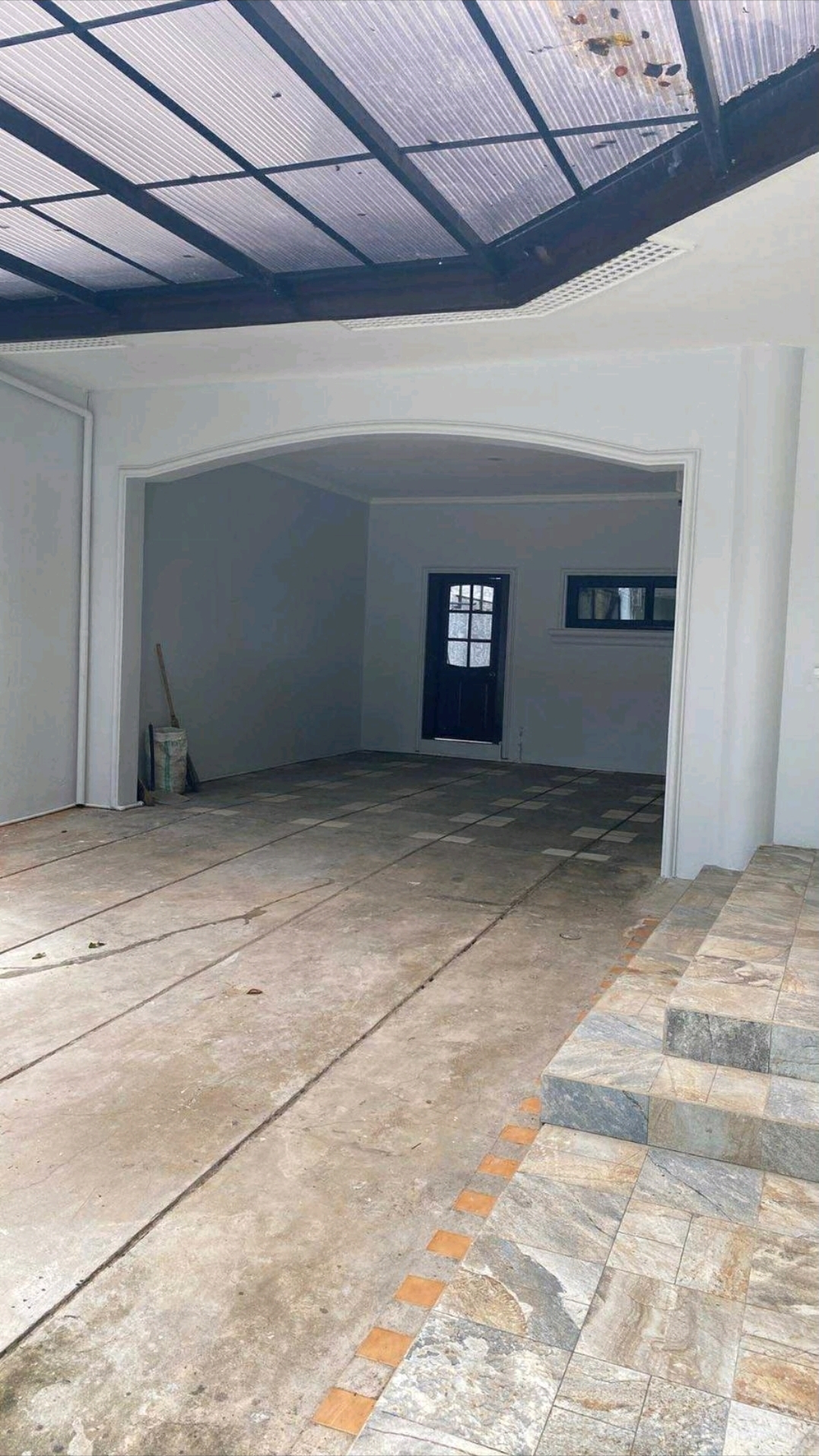 Covered 4-car garage and service access area