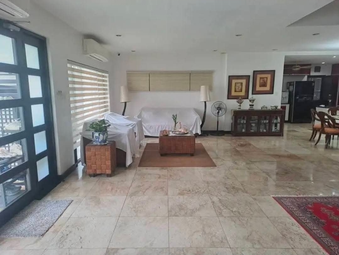 Bright open living space with marble flooring