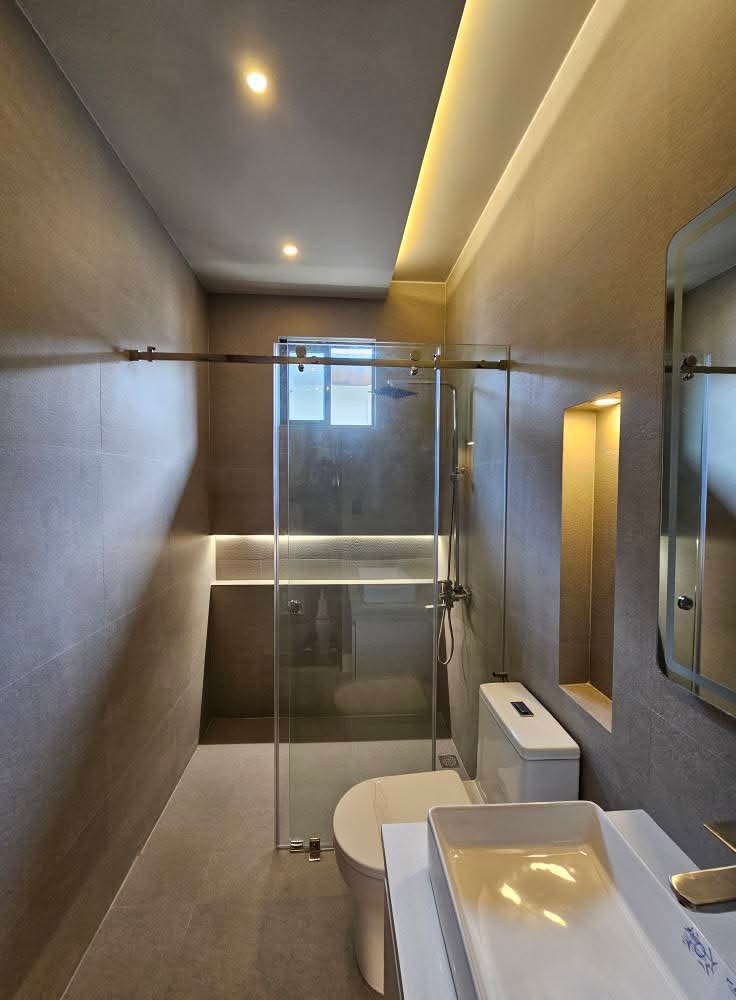 Modern en-suite bathroom with walk-in rain shower