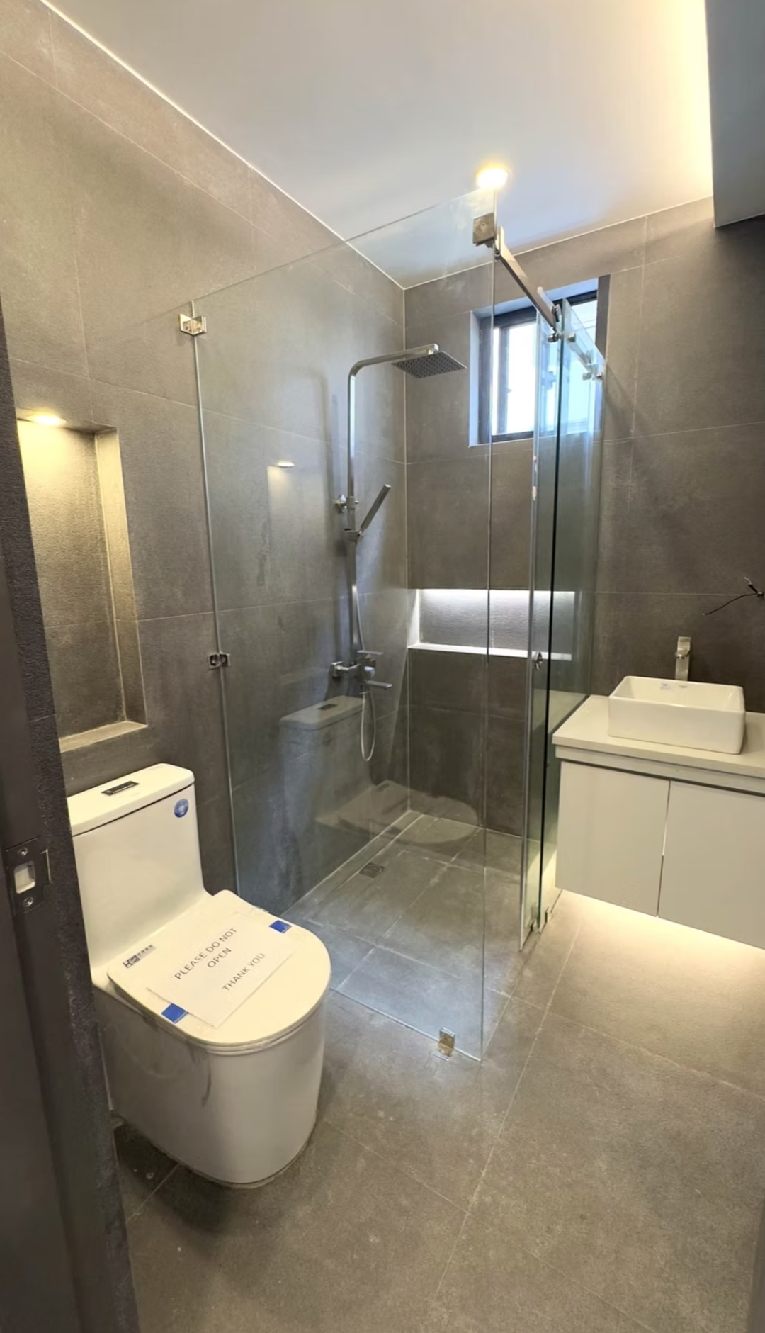 Modern bathroom with rain-shower enclosure and vessel sink