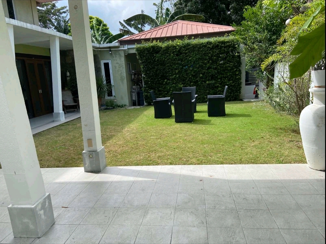 Landscaped garden with cabana and outdoor seating