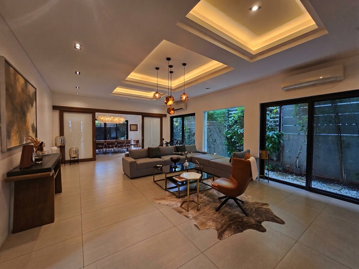 Light-filled living room with coffered ceiling, garden-facing windows and contemporary seating