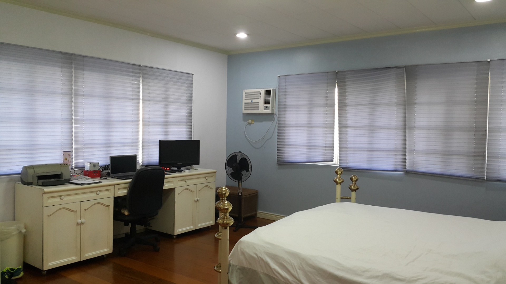Second bedroom with built-in desk and wide windows