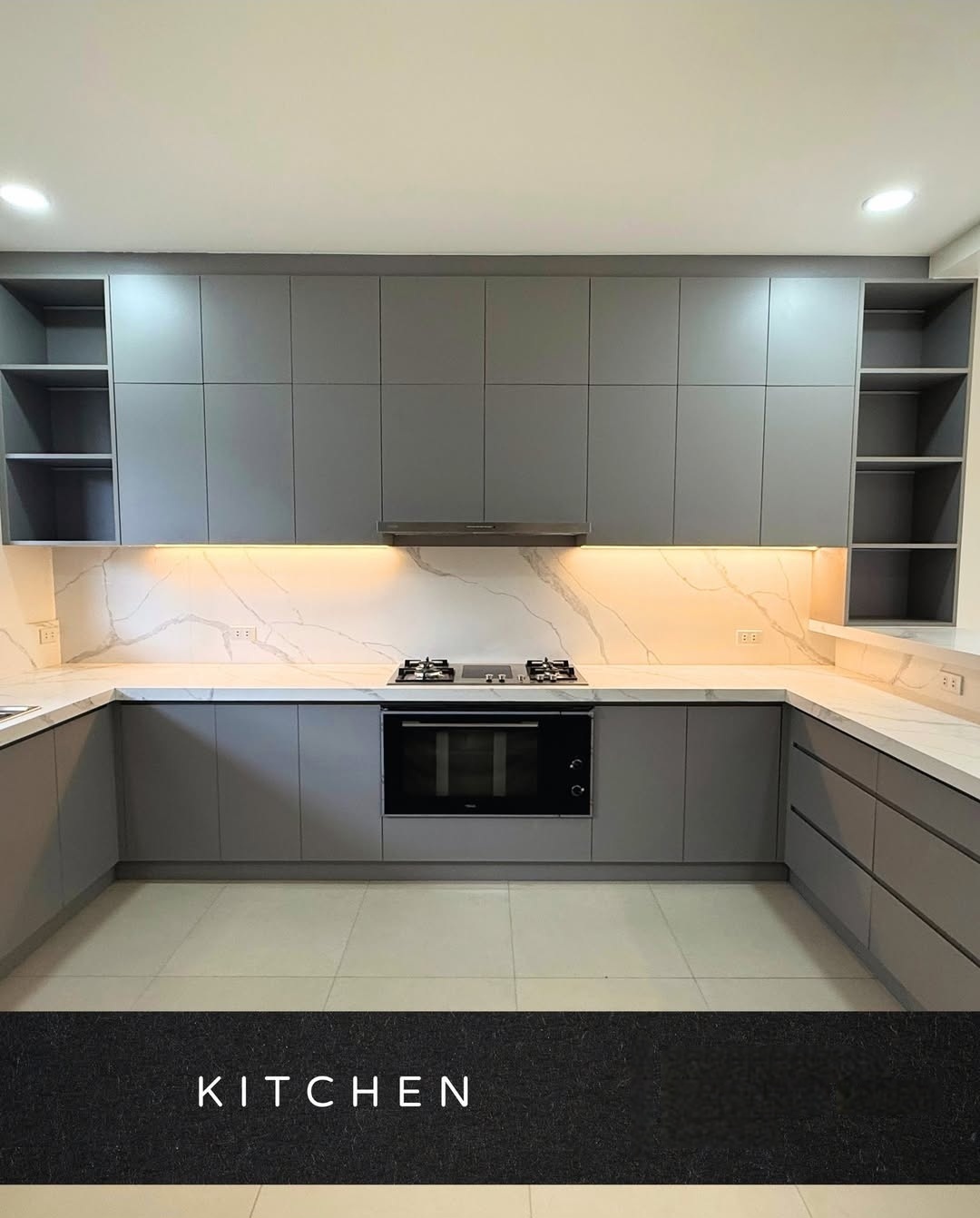Modern grey kitchen with marble backsplash