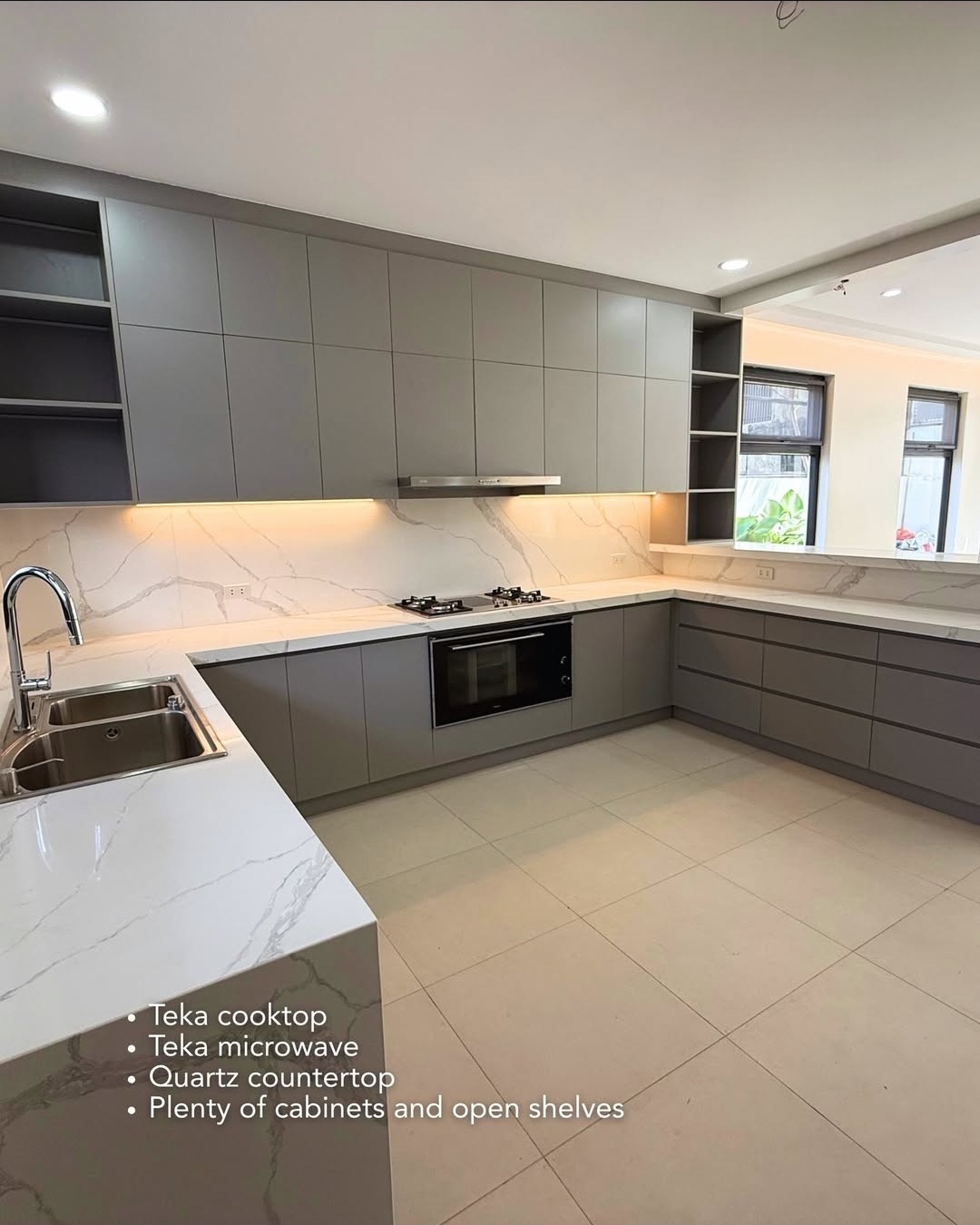 Kitchen with double sink and ample cabinetry