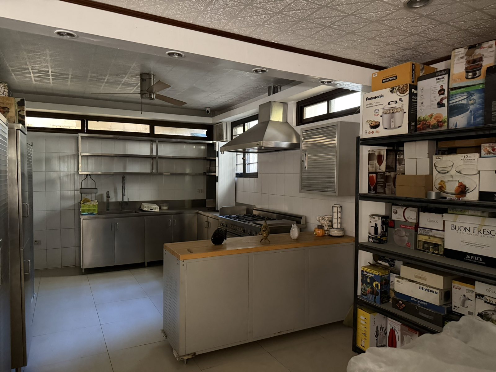 Clean and dirty stainless-steel kitchen with island