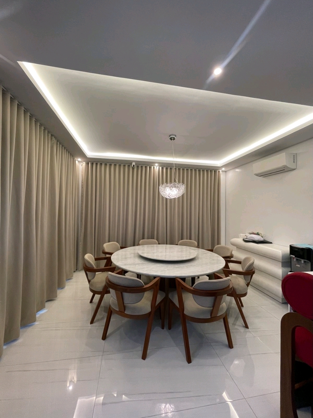 Formal dining area with round marble table