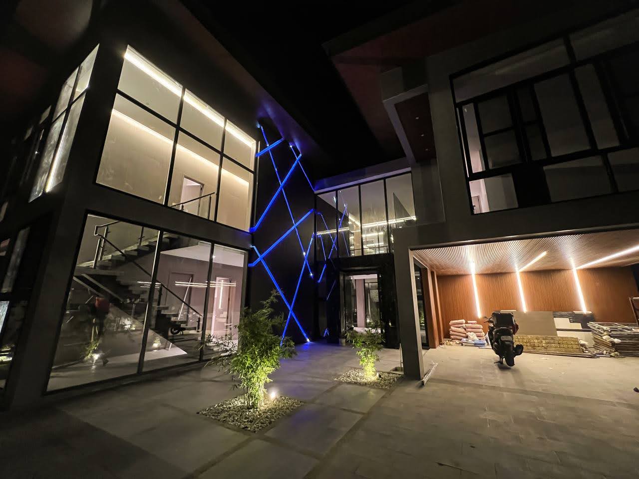 Courtyard at night with sculptural lighting feature