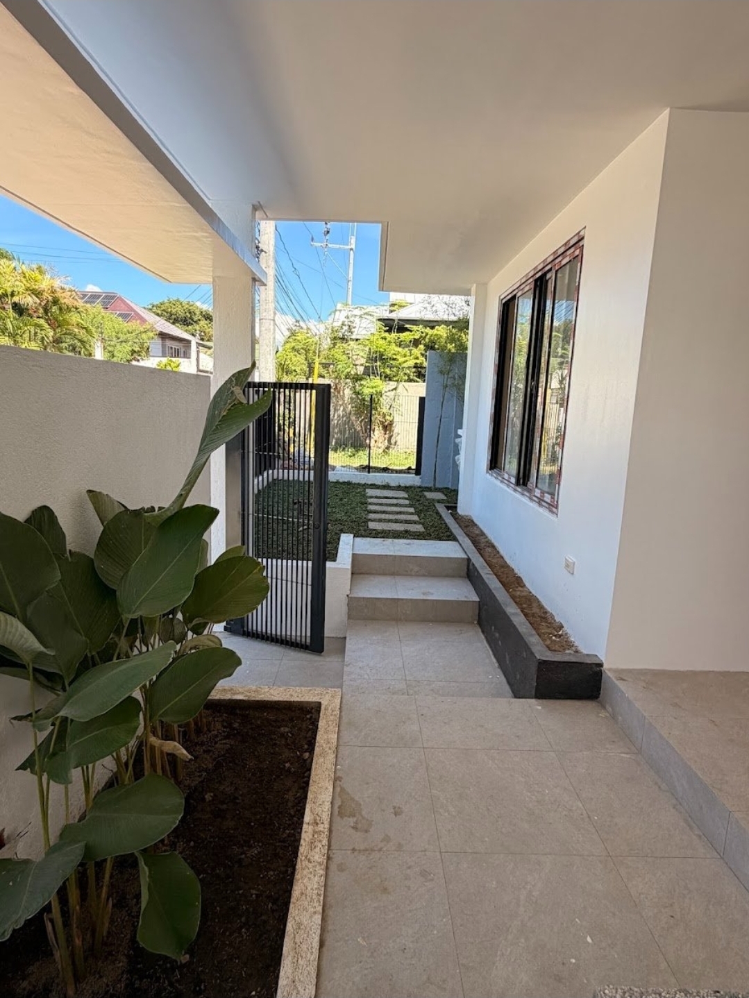 Landscaped side garden pathway alongside the home