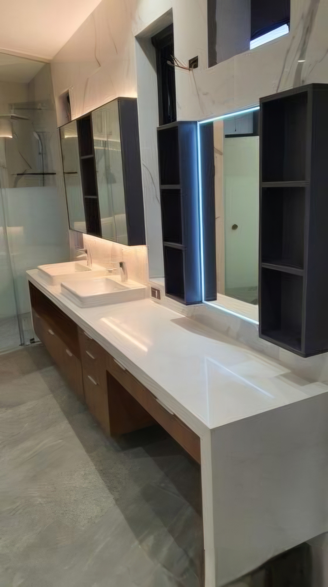 Double-vanity bathroom with LED mirror and dark cabinetry