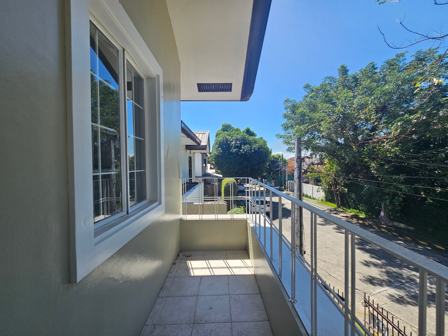 Master bedroom balcony with street-view and morning sun