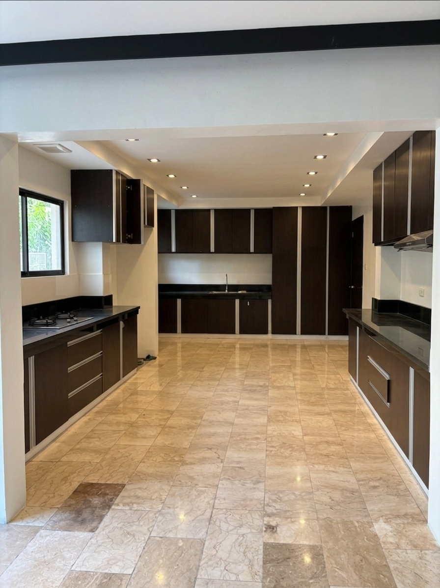 Sleek dark-cabinet kitchen with stone countertops