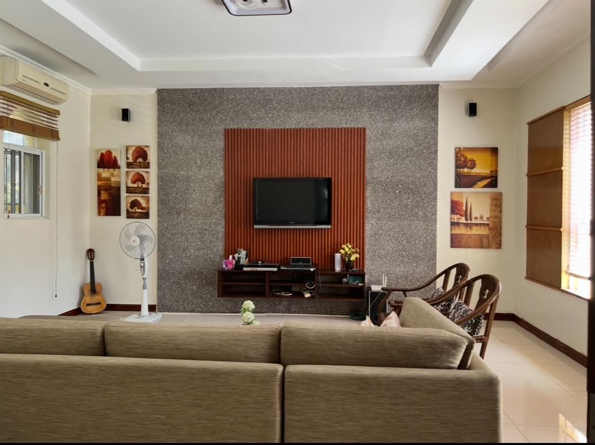 Entertainment room with feature wall and wide media console