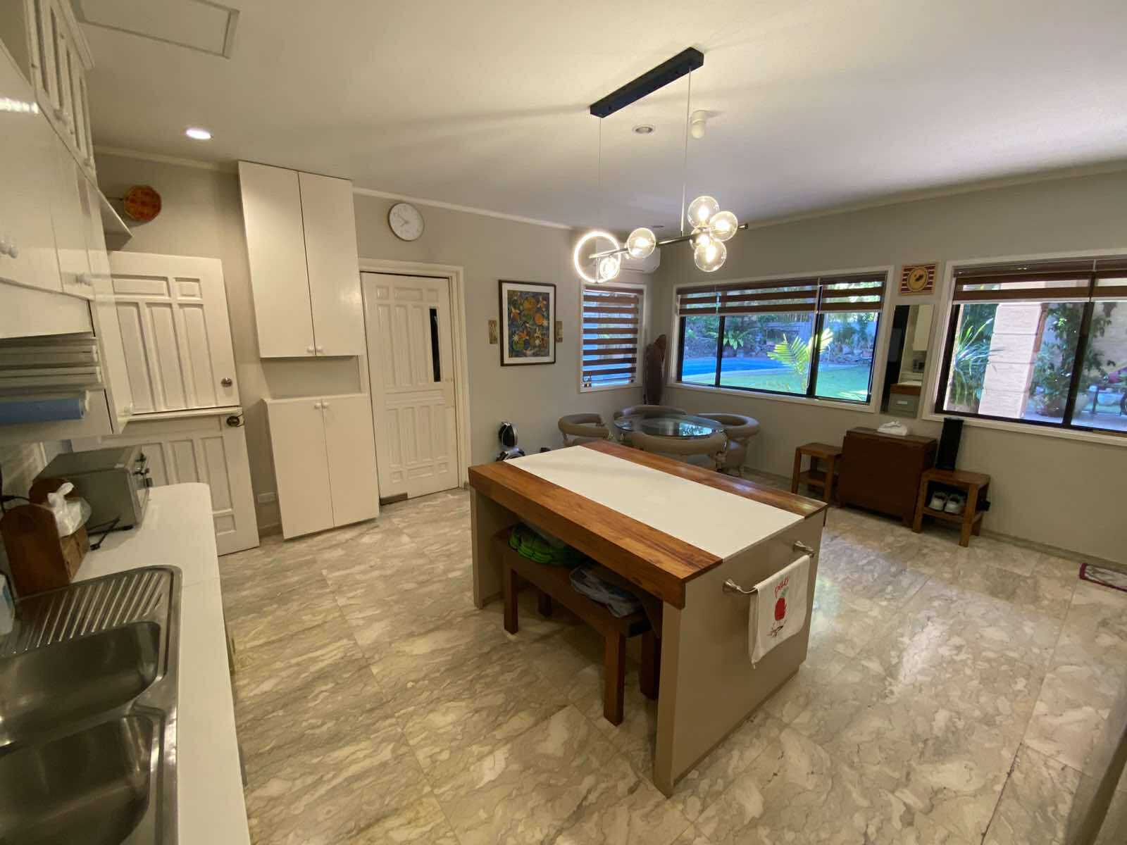 Main kitchen with island, breakfast nook, and garden windows
