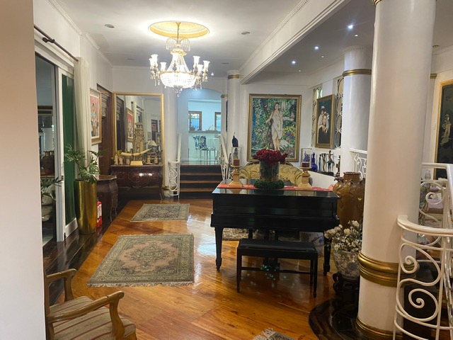 Piano hall with columns, chandeliers and narra flooring