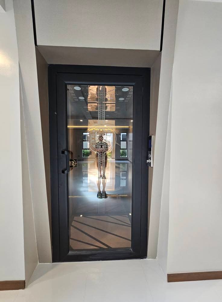 Private home elevator with keypad access off the main hall