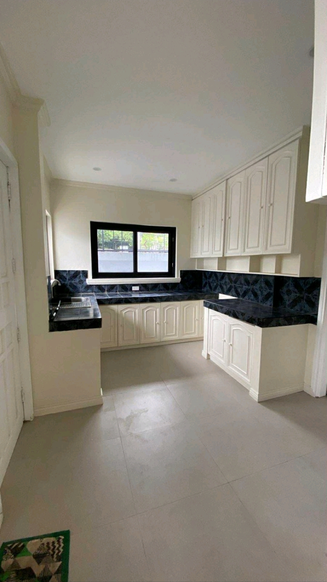 Second angle of the renovated kitchen and work surfaces