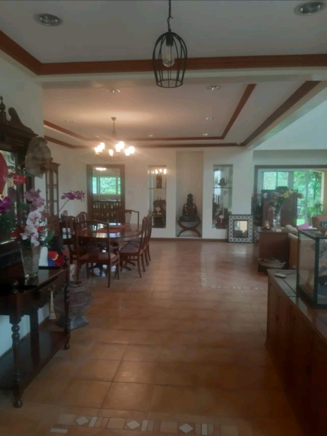 Formal dining hall with narra dining set, coffered ceilings and hardwood accents