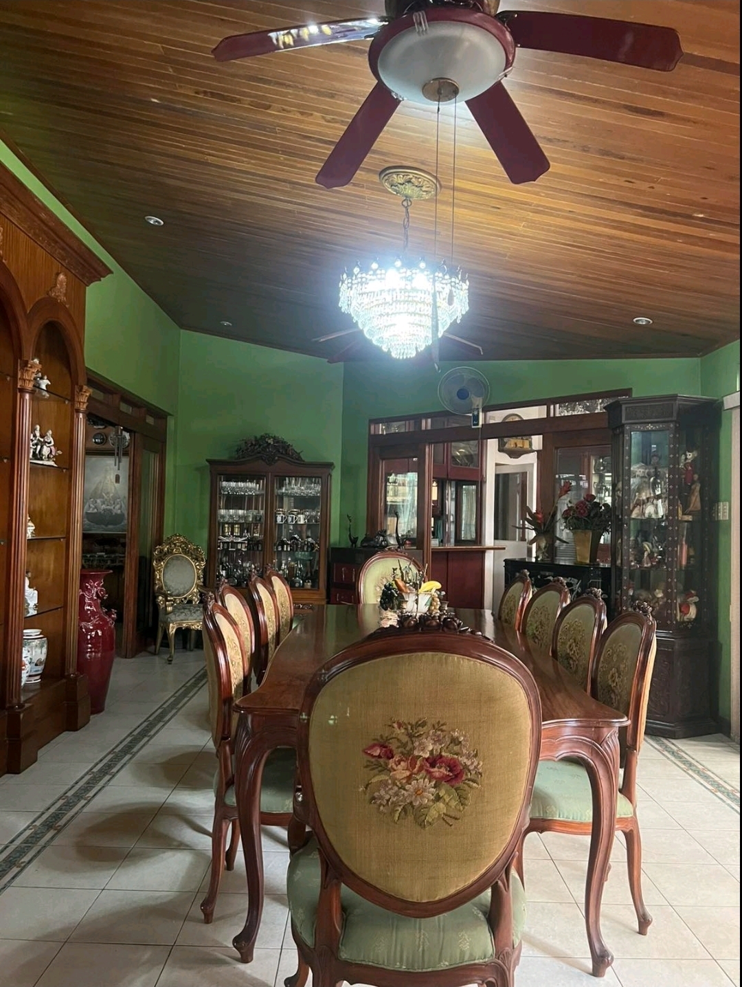 Formal dining room with crystal chandelier and heritage cabinetry