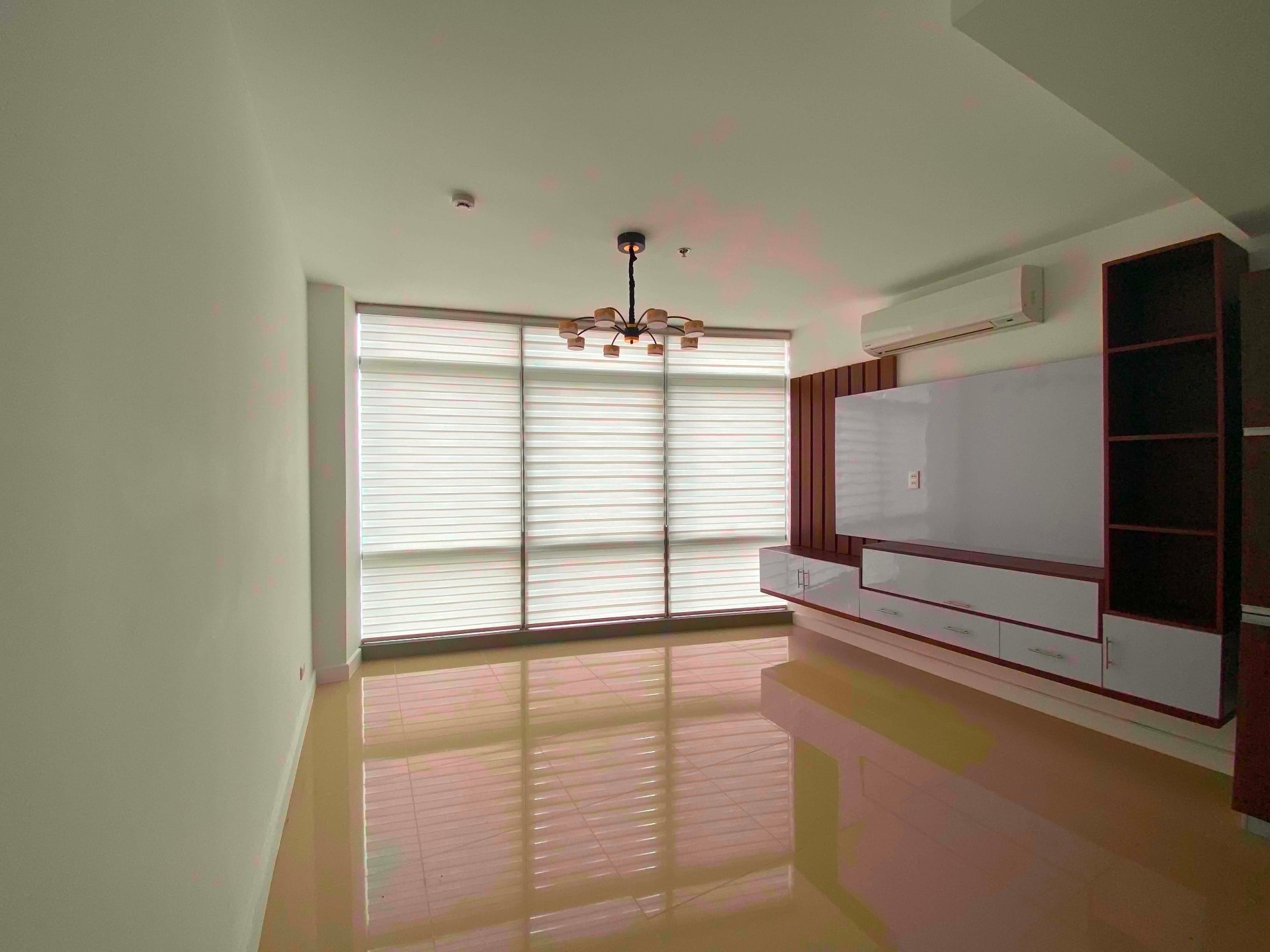 Dining area with warm wood accents and skyline-facing windows