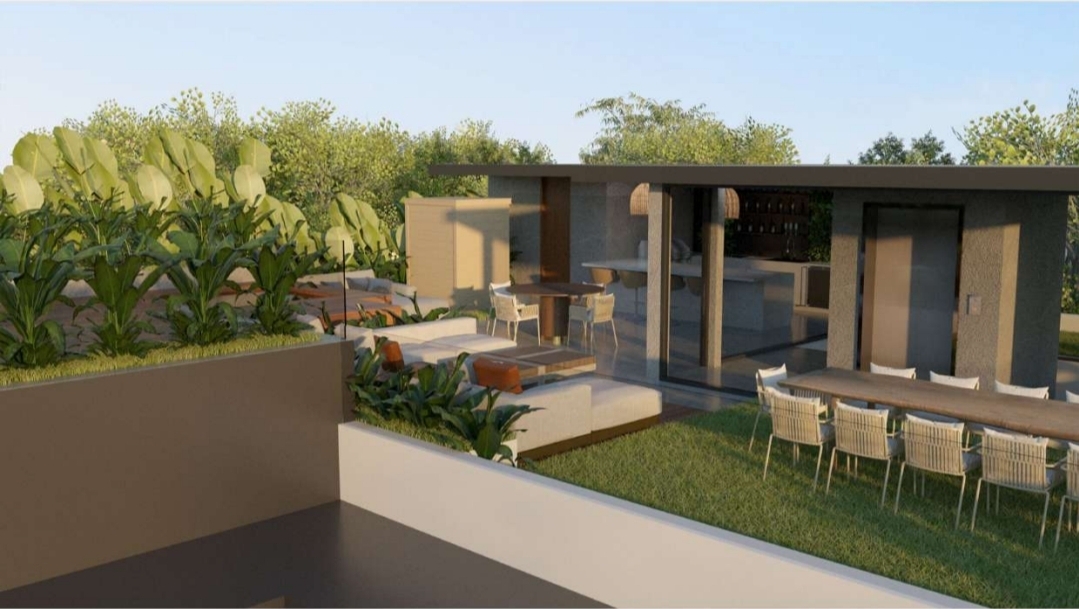 Roof deck outdoor dining table set on lawn beside the pavilion and elevator lobby