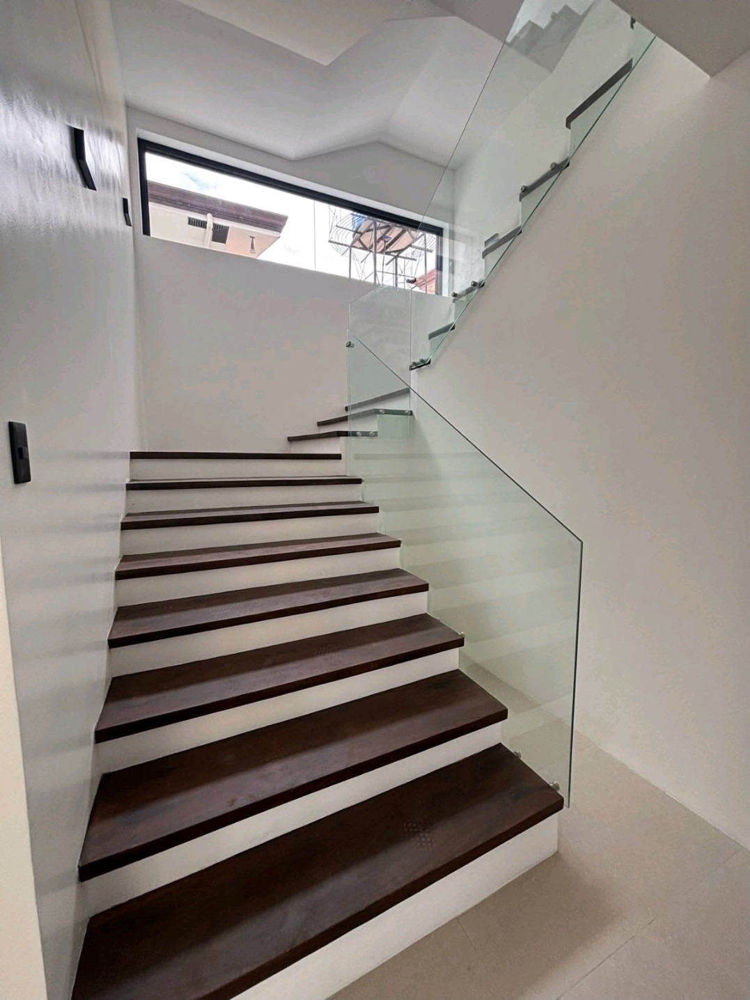 Timber staircase with frameless glass balustrade