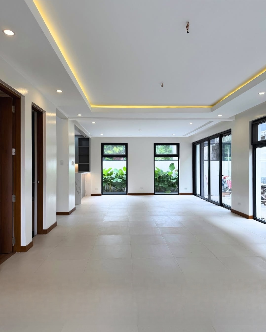 Bright open living area with floor-to-ceiling windows