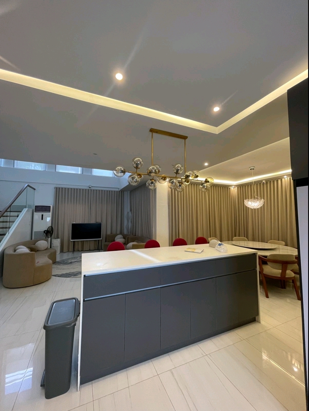 Kitchen island opening to living and dining areas