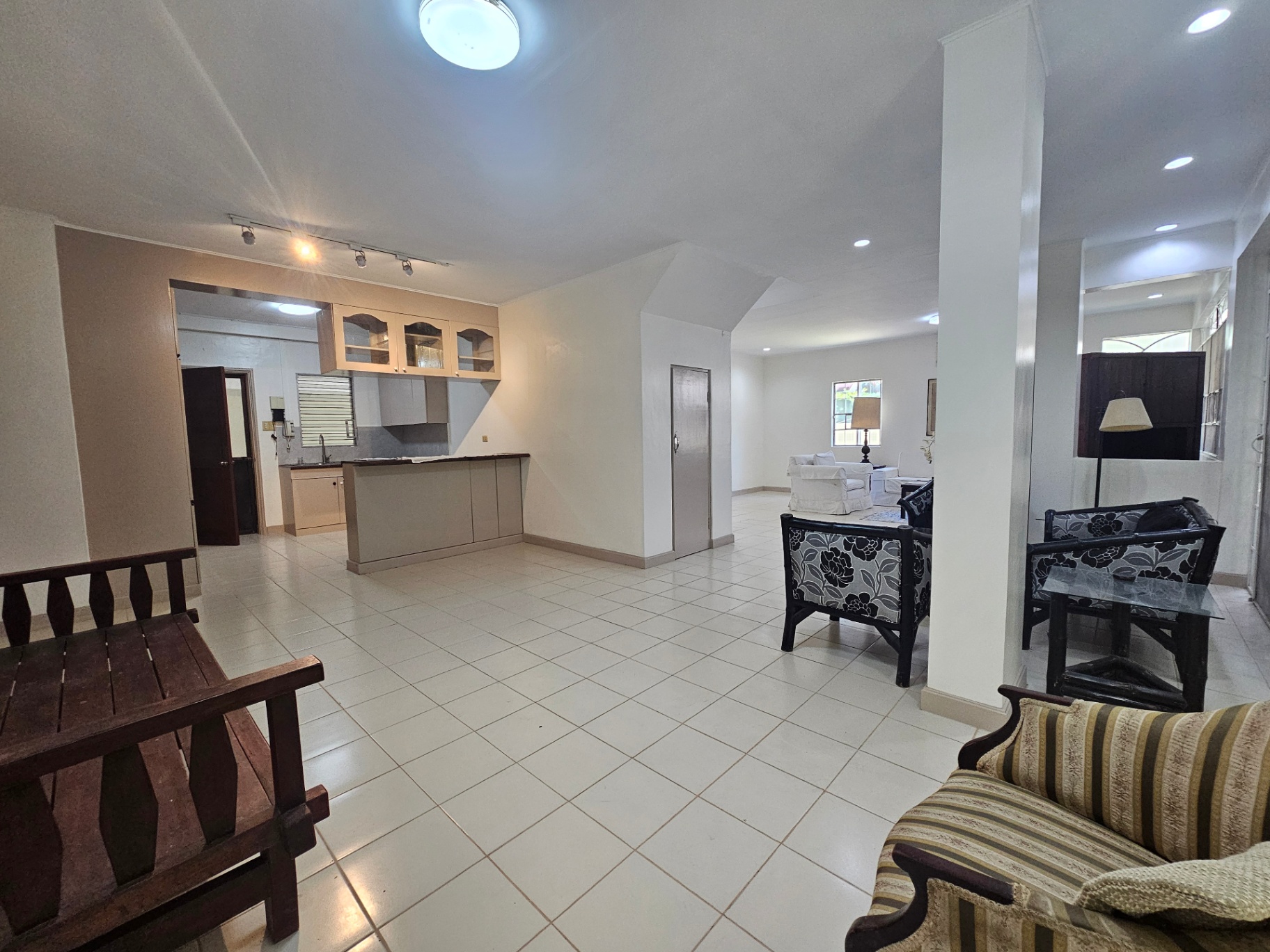 Open-plan living and dining with breakfast counter and seating