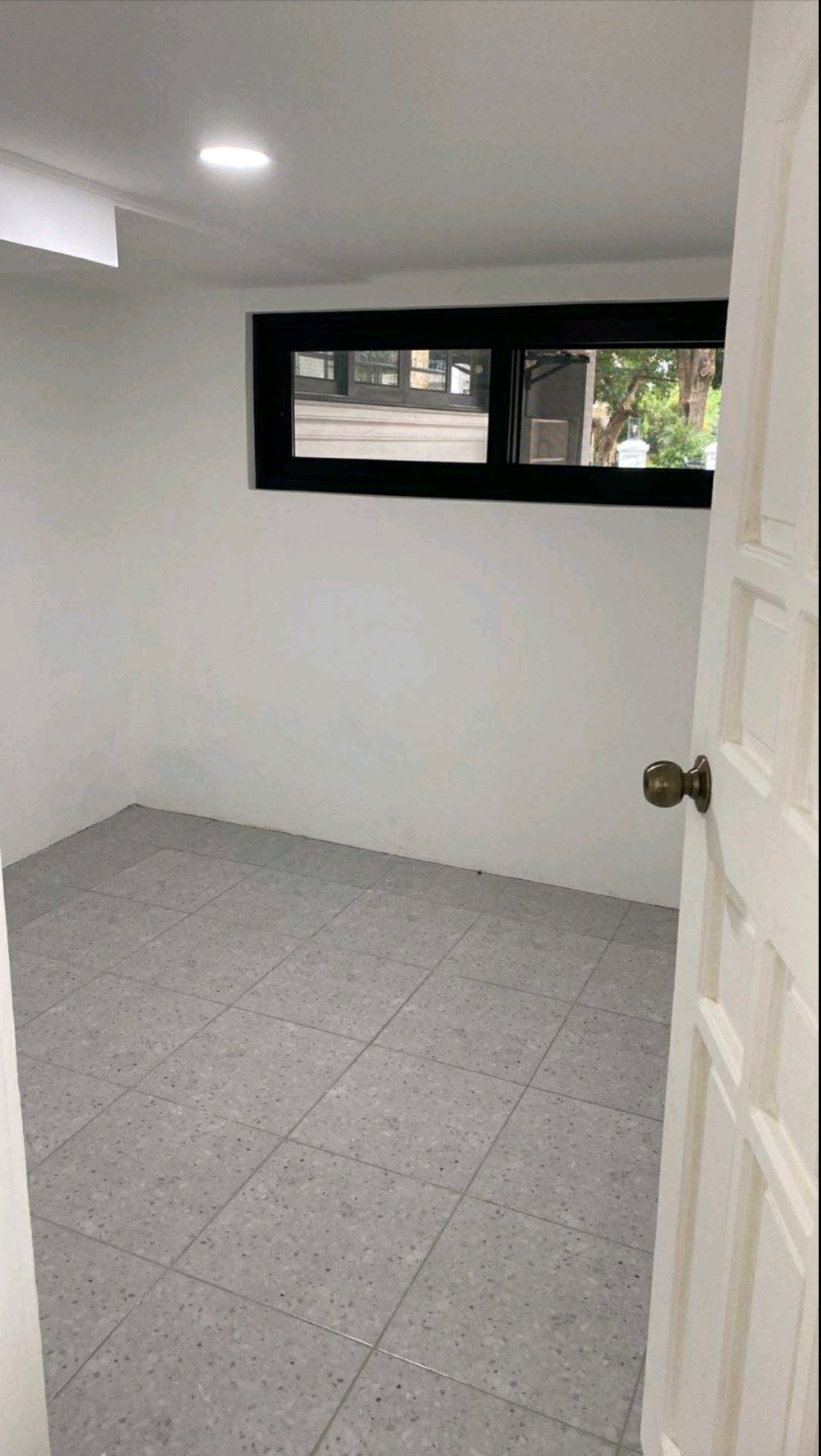 Additional staff or driver room with tiled flooring