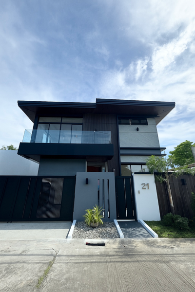 Front elevation with balcony and modern gate in Sinagtala Village