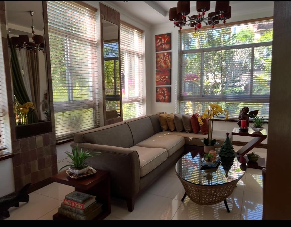 Sun-filled sitting room with garden views