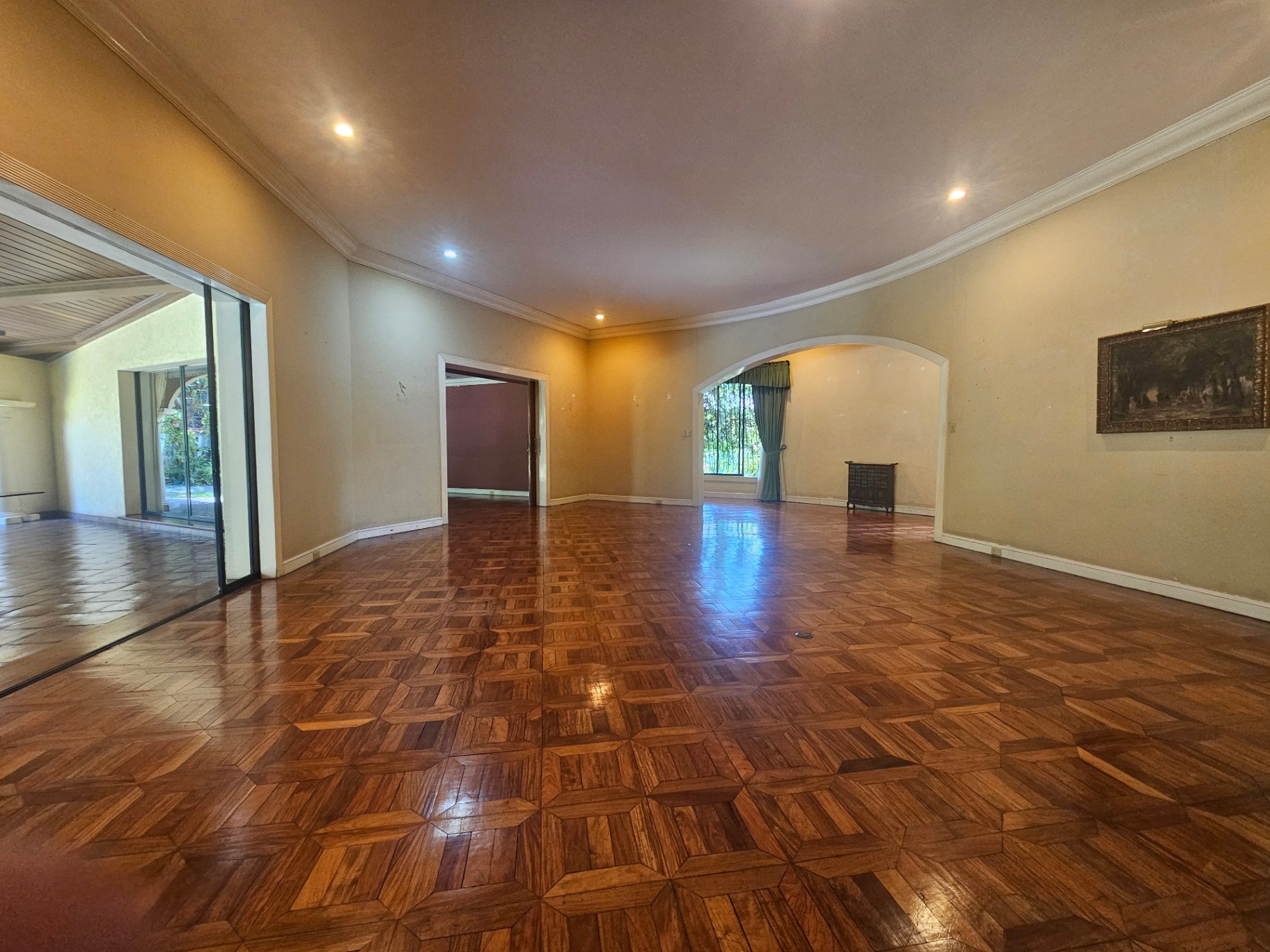 Main living area opening toward the covered lanai and garden