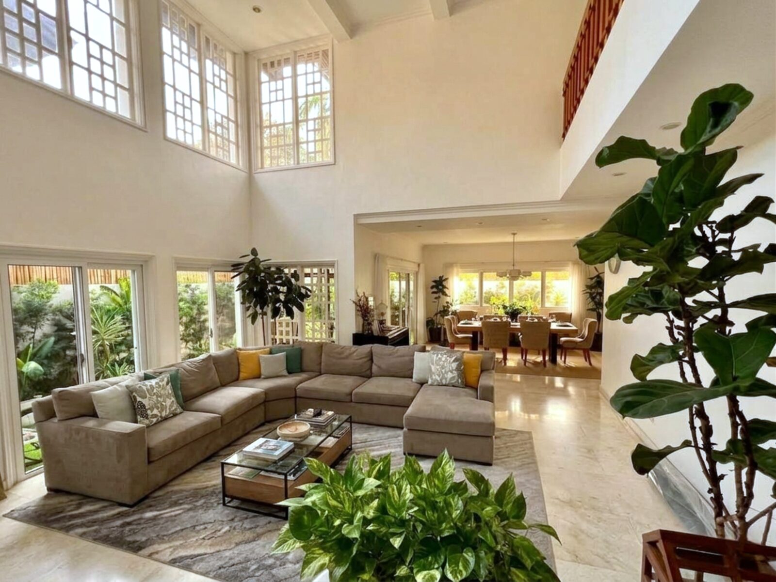 Bright two-storey living area opening to the dining room with garden views