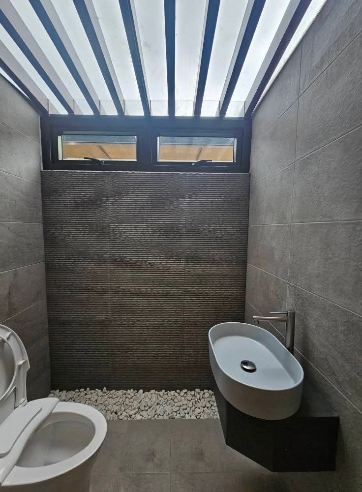 Powder room with skylight, pebble drain and floating vanity