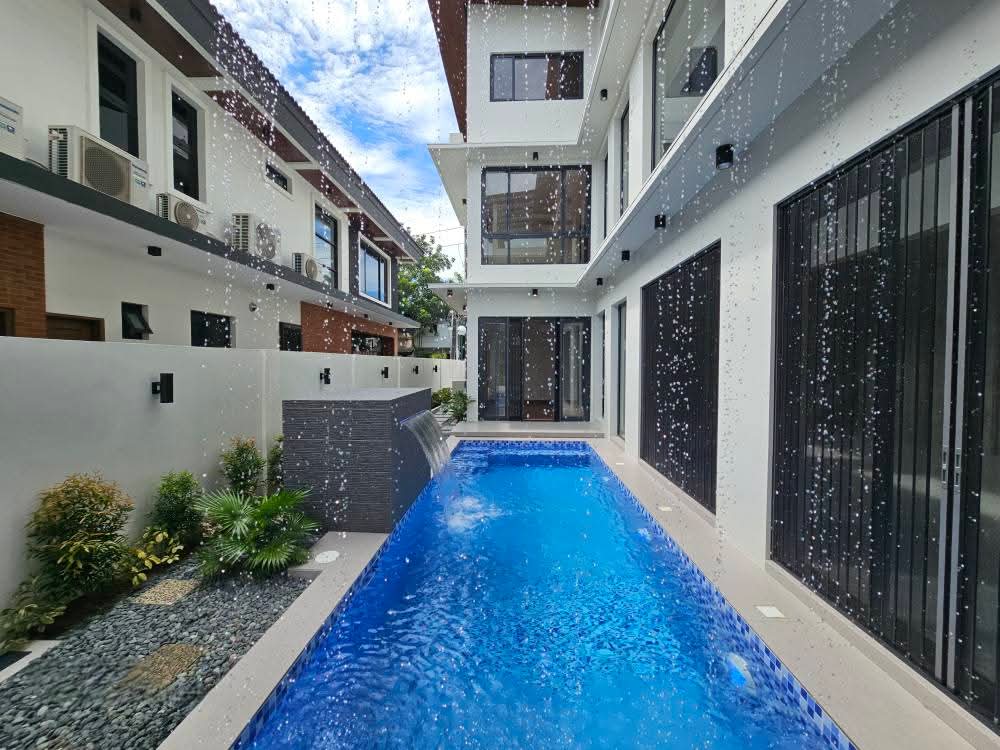 Lap pool with cascading waterfall feature wall
