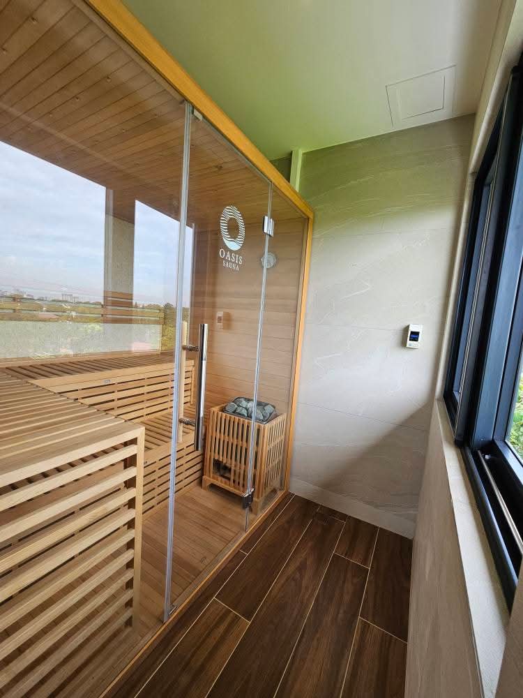 Glass-walled Oasis sauna with panoramic windows