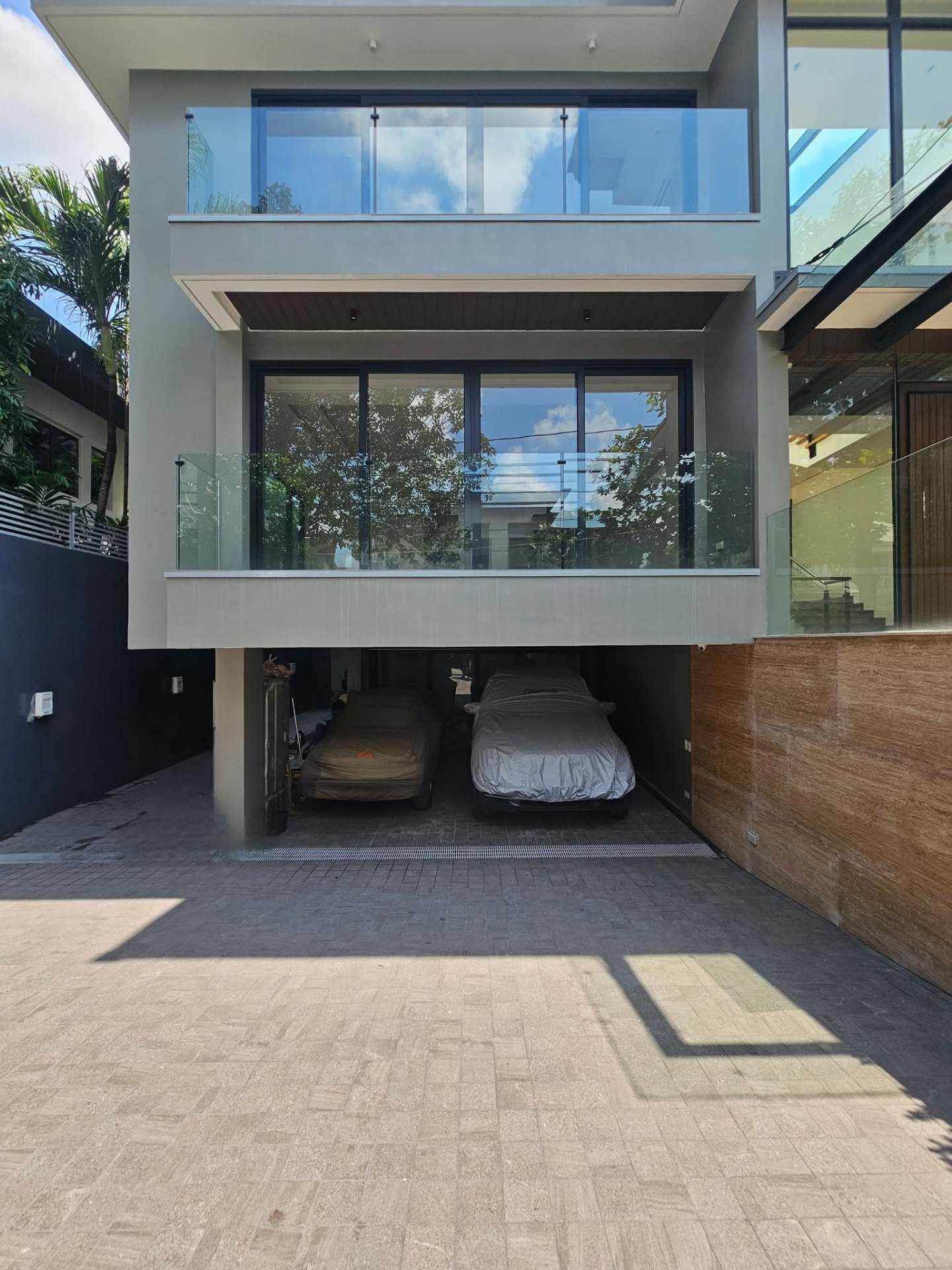 Covered 4-car garage tucked beneath the upper floors
