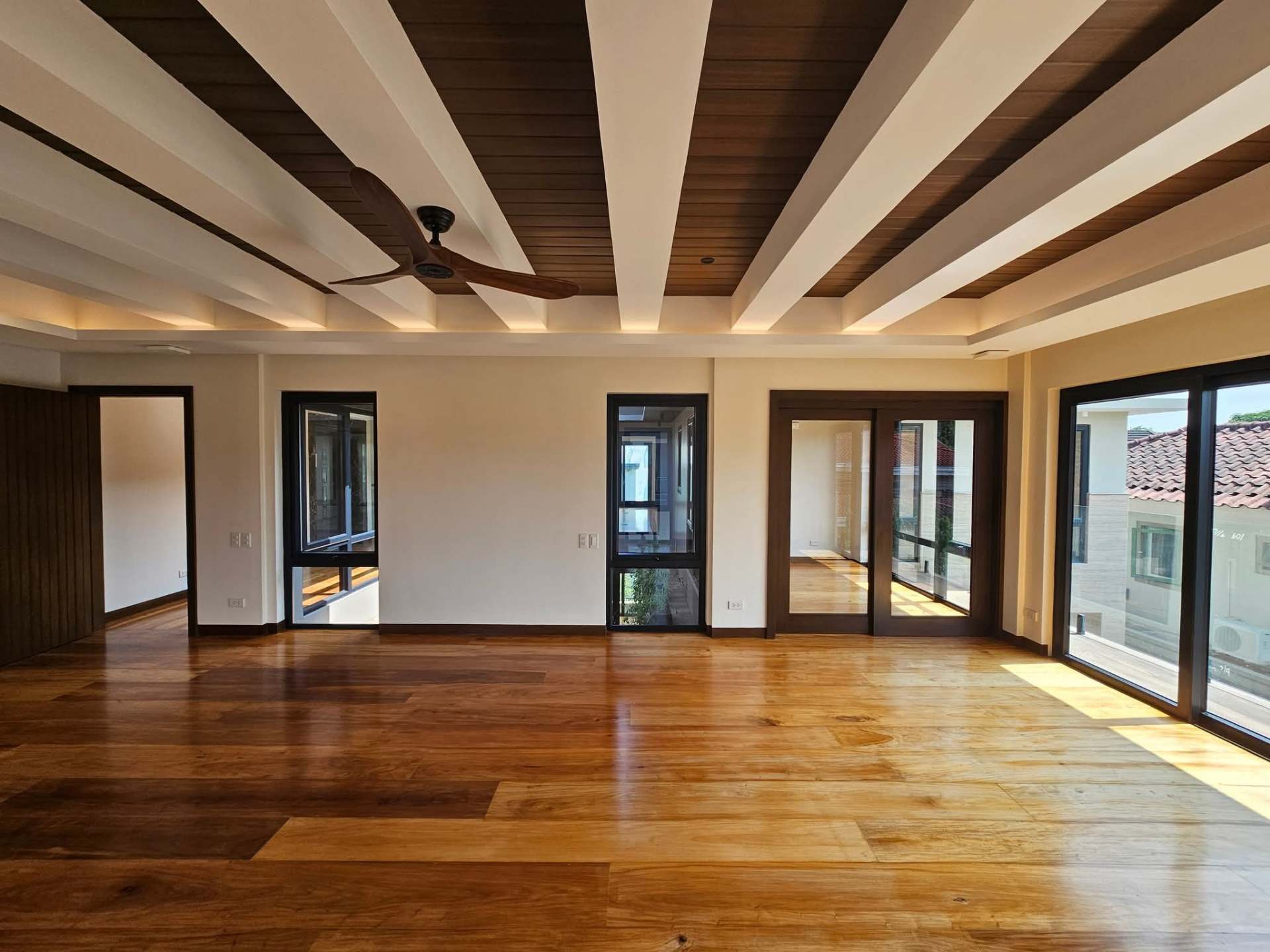 Spacious master suite with coffered timber ceiling