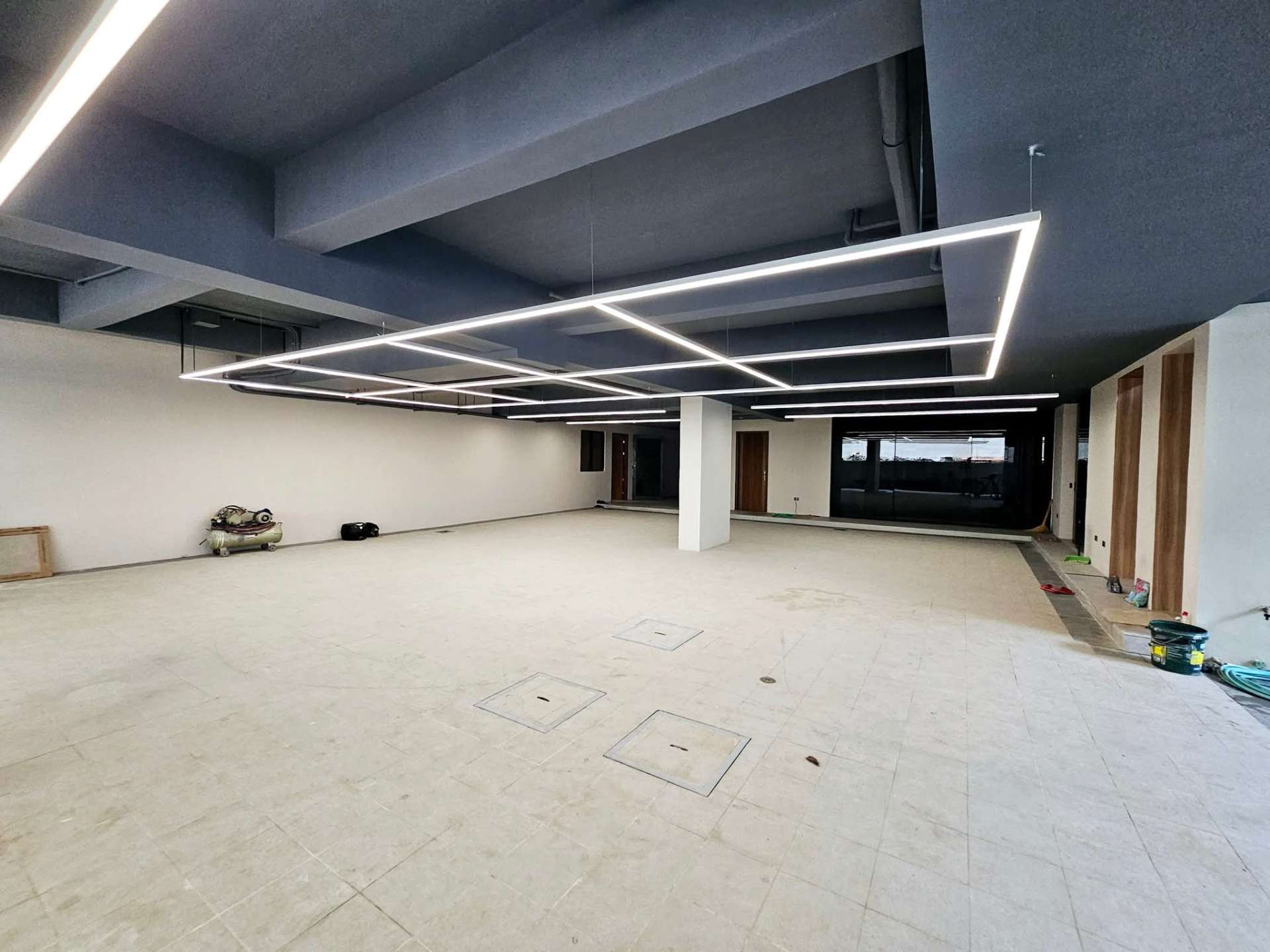8-car basement garage with sculptural linear LED ceiling