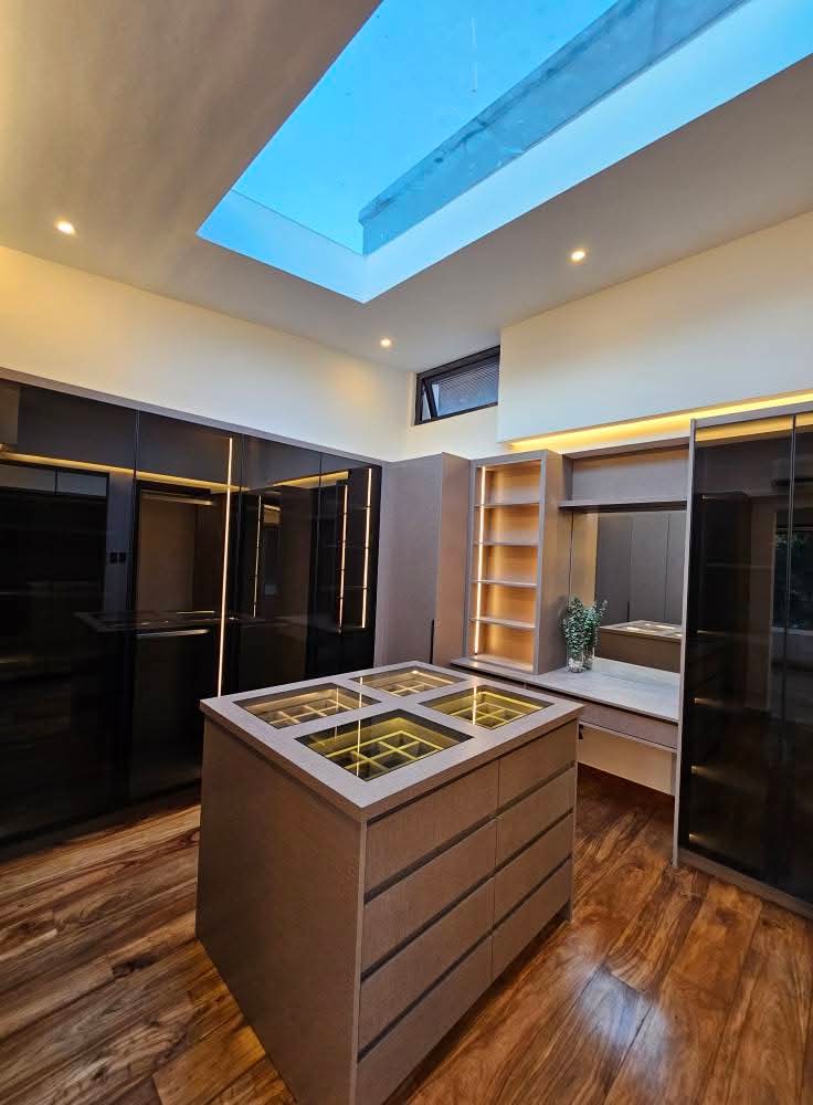Walk-in closet with skylight and central jewelry island
