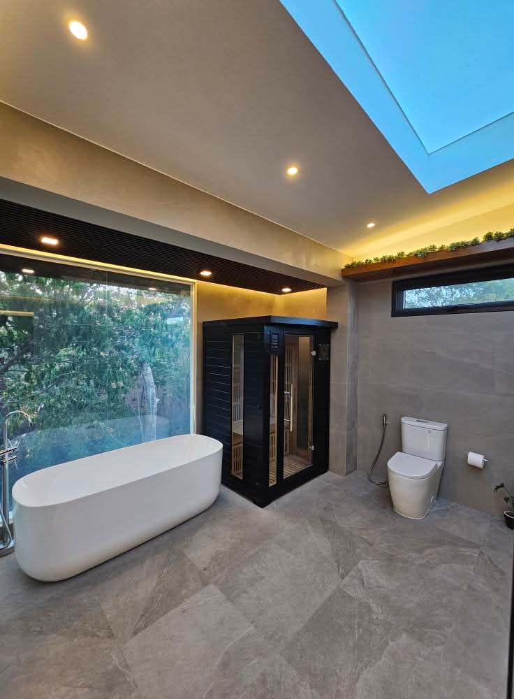 Spa bathroom with freestanding tub and sauna