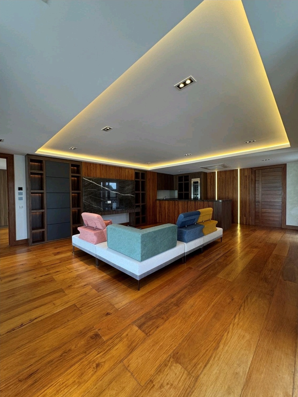 Top-floor entertainment lounge and mancave with Narra cabinetry